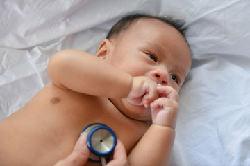 Baby sick concept. The doctor is examining the baby's illness. Babies are not comfortable in the hospital.