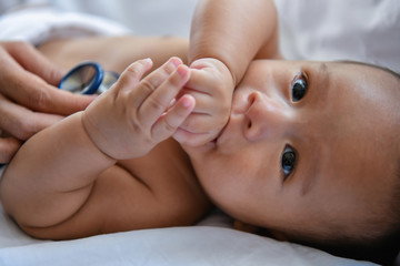 Baby sick concept. The doctor is examining the baby's illness. Babies are not comfortable in the hospital.