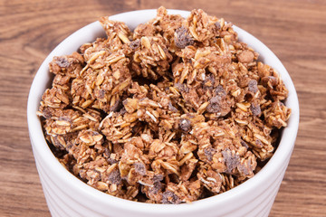 Oat flakes or granola with chocolate containing iron and fiber, healthy snack concept