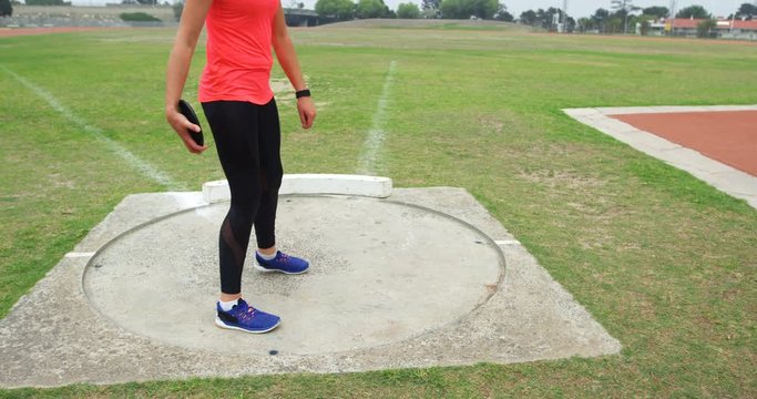 Female athlete getting ready for discus throw 4k
