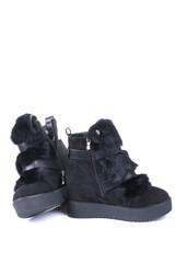 Female winter boots on high soles on a white background