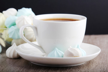 A cup of coffee and meringues for breakfast