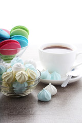 A cup of coffee and macaroons ready for breakfast