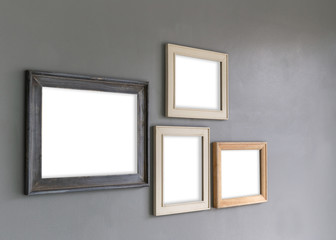 Group of Blank photo frames on the wall for your design