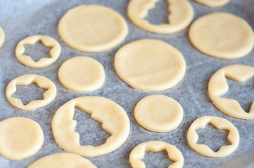 Fototapeta na wymiar Cooking homemade Christmas cookies. Cutting out dough.