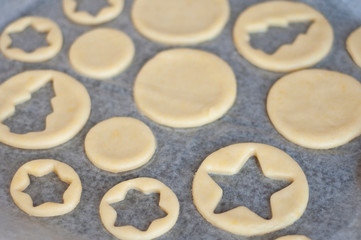 Fototapeta na wymiar Cooking homemade Christmas cookies. Cutting out dough.