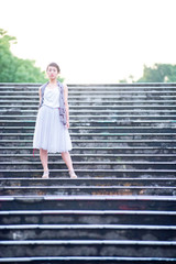 Asian female model poses for pictures in the cityscape