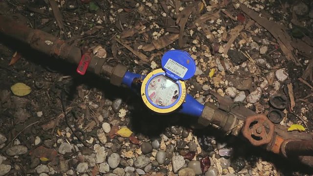 Water meter in the ground hole. Measure the flow of water