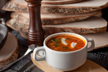 the Russian solyanka with seasonings on a table