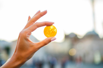 woman holding bitcoin