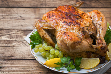 Baked chicken with stuffing for dinner on the holiday table. copy space