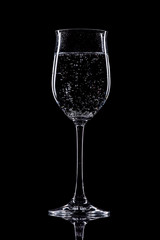 Fototapeta premium glass of white wine isolated on black background