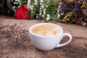 Cappuccino and latte art on the wood table. Free hand pouring some milk on the coffee. Morning breakfast with coffee.