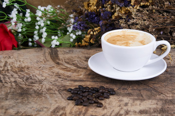 Cappuccino and latte art on the wood table. Free hand pouring some milk on the coffee. Morning breakfast with coffee.