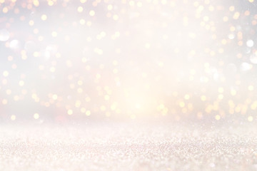 glitter vintage lights background. silver and light gold de-focused.