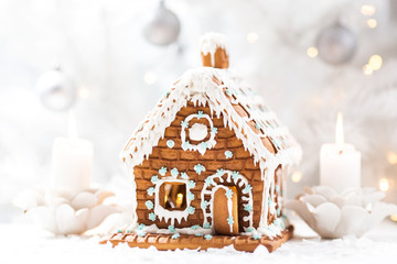 Homemade gingerbread house on a white table