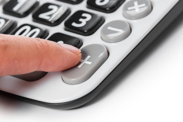Woman hands working on calculator close up