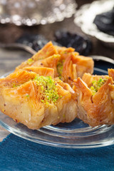Oriental sweets, baklava, sherbet on a blue background