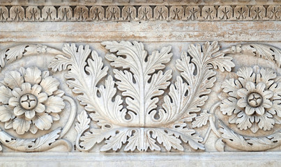 Stone carvings on the portal of Santa Maria Forisportam church in Lucca, Tuscany, Italy