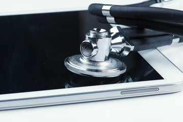 stethoscope and a digital tablet.