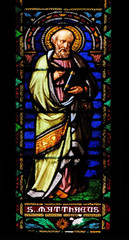 Fototapeta na wymiar Saint Matthew the Evangelist, stained glass window in the San Michele in Foro church in Lucca, Tuscany, Italy