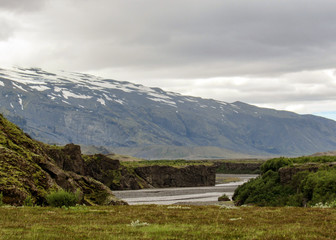 Dramatic icelandic terrain with volcanoes, canyons, glacial rivers, highland deserts and poor vegetation, on the Laugavegur Trail, Highlands of Iceland