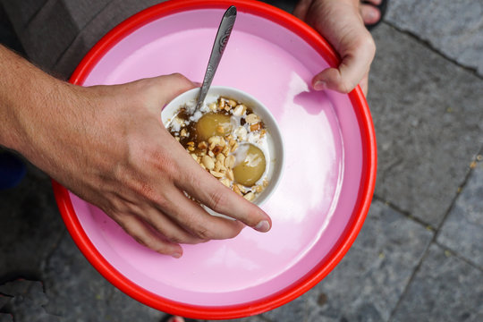 Traditional vietnamese dessert soup, che khoai, with glutinous rice balls filled with black sesame in a hot sweet ginger sauce