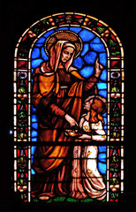 Stained glass window in the Santi Paolino e Donato church in Lucca, Tuscany, Italy 