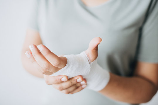 Woman with gauze bandage wrapped around her hand