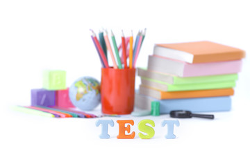 word test on the background of school supplies .photo with copy 