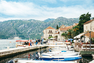 boat in kotor bay. beautiful sea with mountains on background