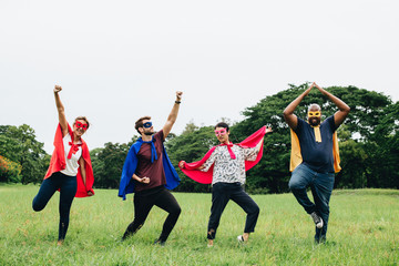 Adult superheroes enjoying in the park
