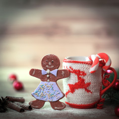 Christmas Cup ornament and a fun gingerbread on a wooden table