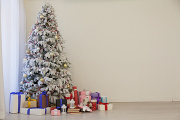 White Christmas tree with gifts Garland lights new year winter holiday