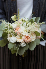 Man holding a bouquet of flowers
