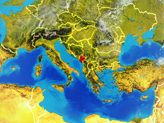 Montenegro from space on model of planet Earth with country borders. Extremely fine detail of planet surface and clouds.