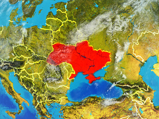 Ukraine from space on model of planet Earth with country borders. Extremely fine detail of planet surface and clouds.