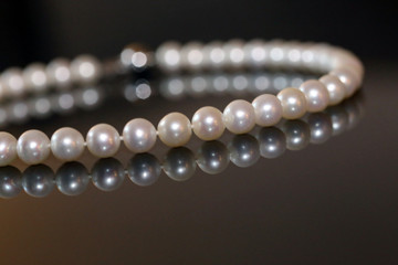 Pearl necklace isolated on black