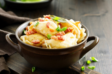 dumplings with potatoes in onion and bacon sauce. Varenyky, vareniki, pierogi, pyrohy.