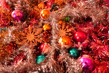 Fototapeta na wymiar christmas balls and tinsel on red background