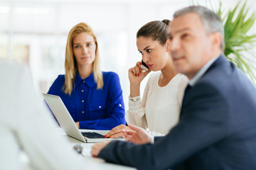 Group of business people working as team in office