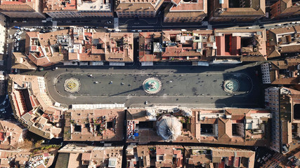 Aerial drone view of iconic landmark Piazza Navona Square featuring Fountain of the Four Rivers with an Egyptian obelisk and Sant Agnese Church in the heart of Rome, Italy