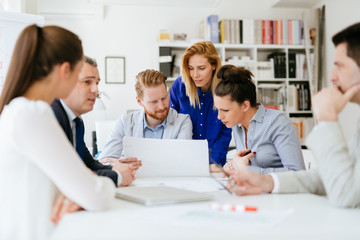 Fototapeta premium Group of business people working as team in office