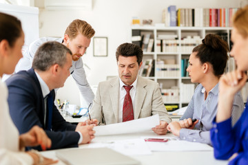Businesspeople collaborating in office
