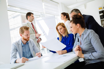 Group of business people working as team in office
