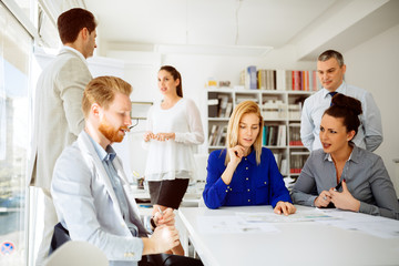 Group of business people working as team in office