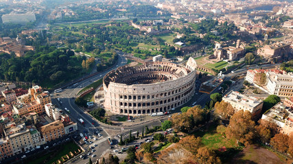 Aerial drone view of iconic ancient Arena of Colosseum, also known as the Flavian amphitheatre in...