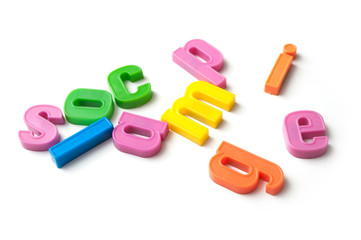 Fototapeta premium closeup of colorful plastic letters on white background