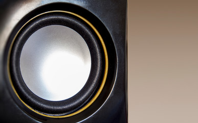 Close-up music set speaker. Black, yellow and white color.