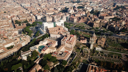 Fototapeta premium Aerial drone view from Roman Forum one of the main tourist attractions which was build in ancient times as the site of triumphal processions and elections next to Colosseum, Rome, Italy